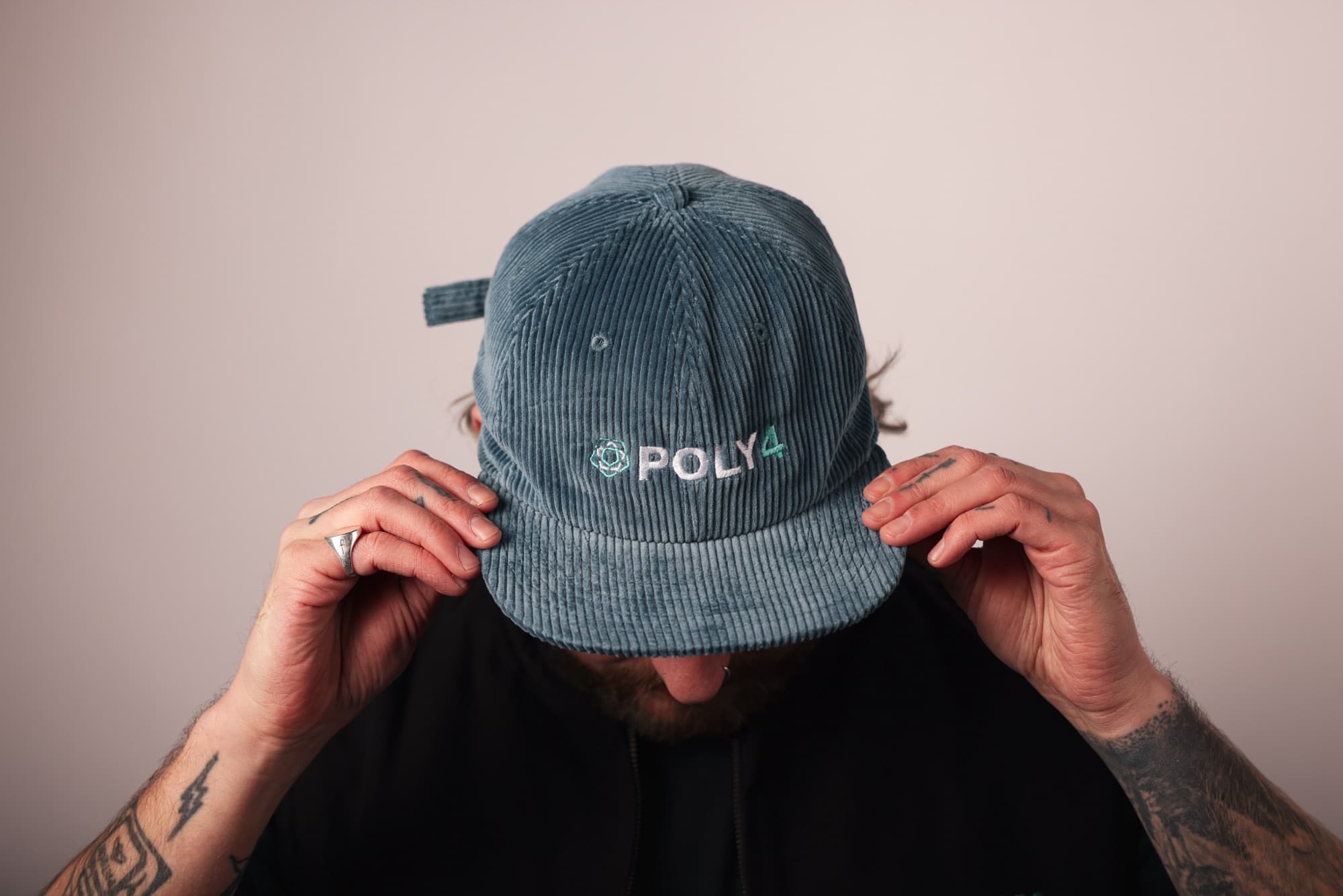 A branded Poly4 corduroy cap