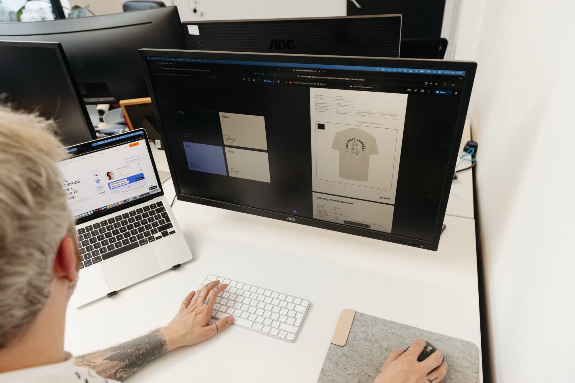 Designer reviewing branded merchandise artwork proofs