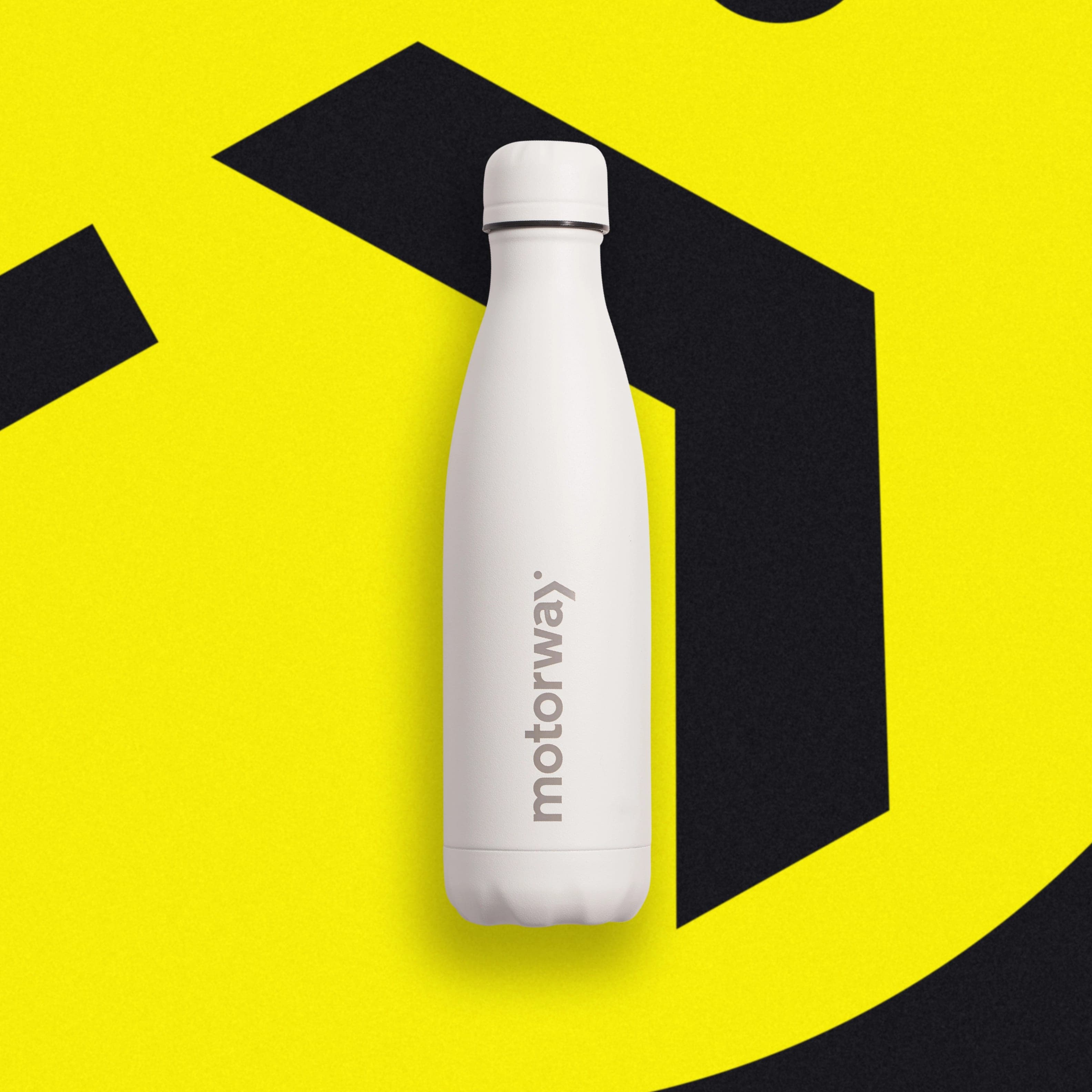 A matte white insulated bottle with a vertical grey Motorway wordmark